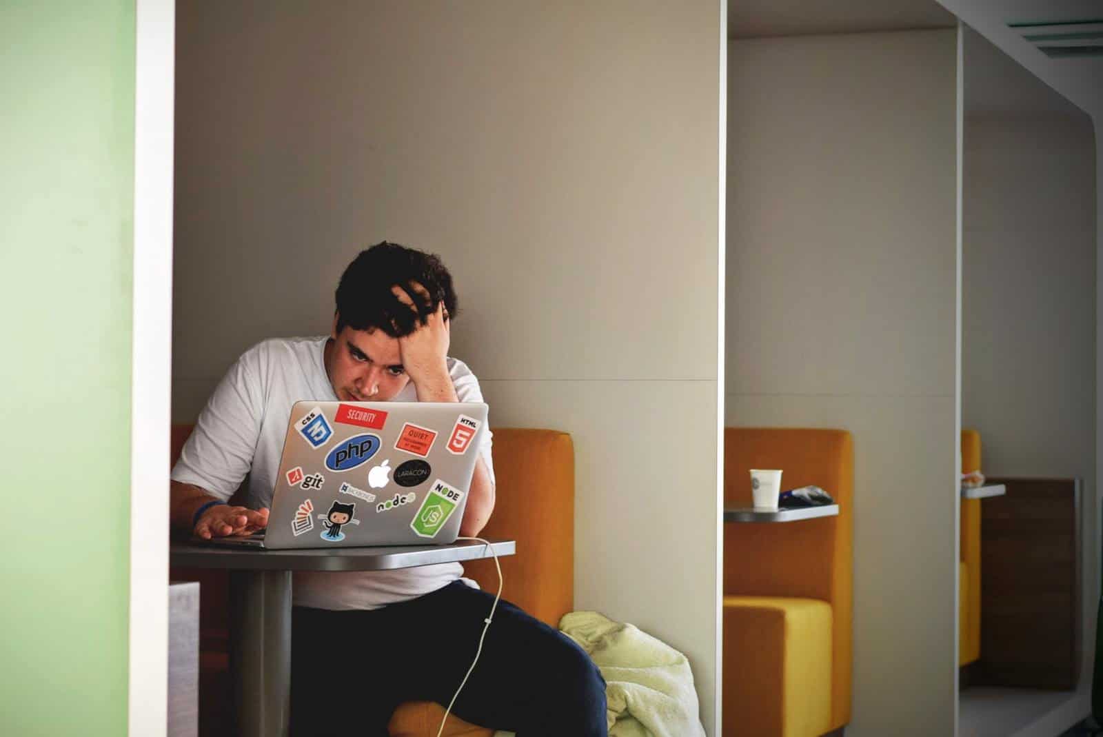 Stressed man with laptop