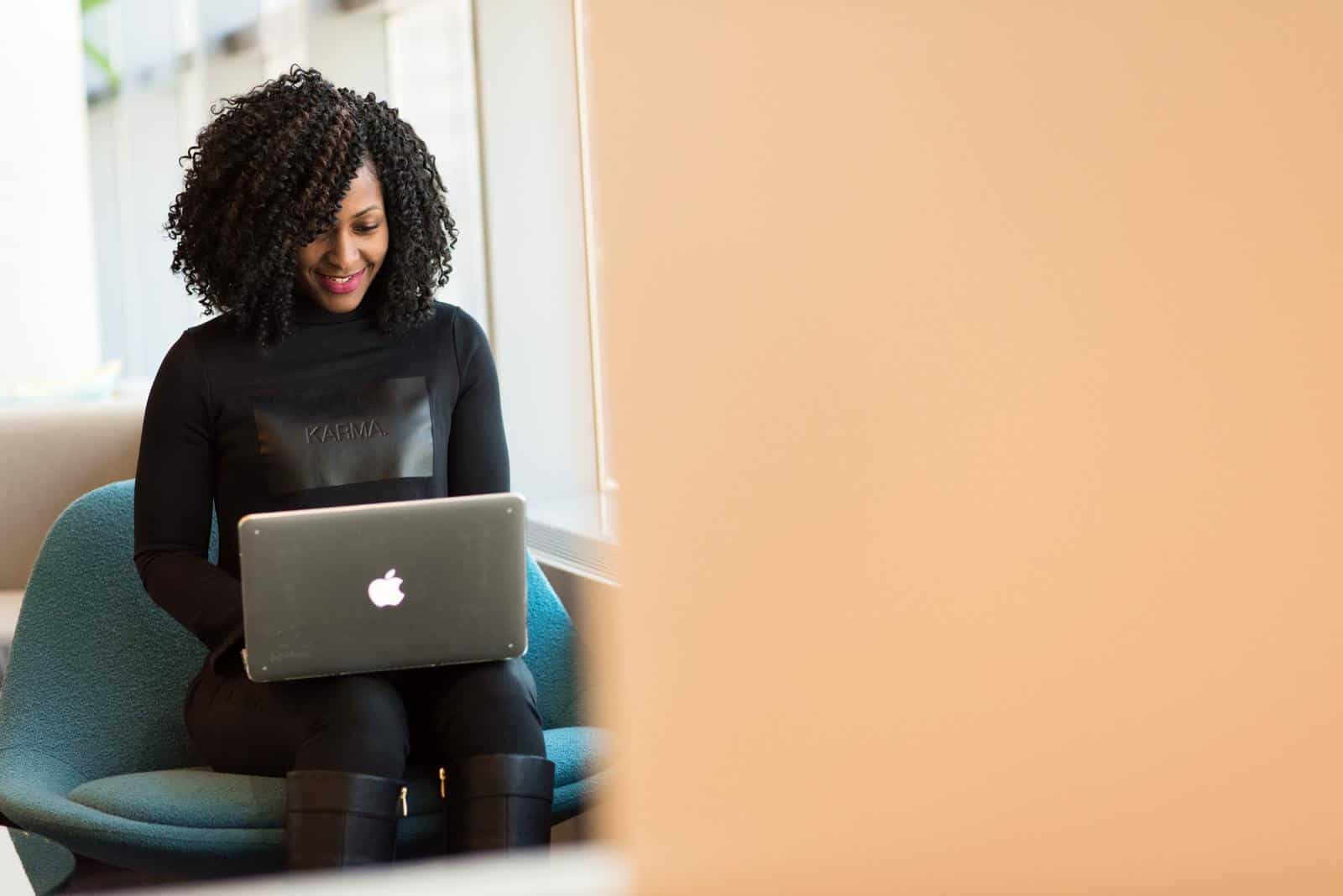 Woman smiling at laptop