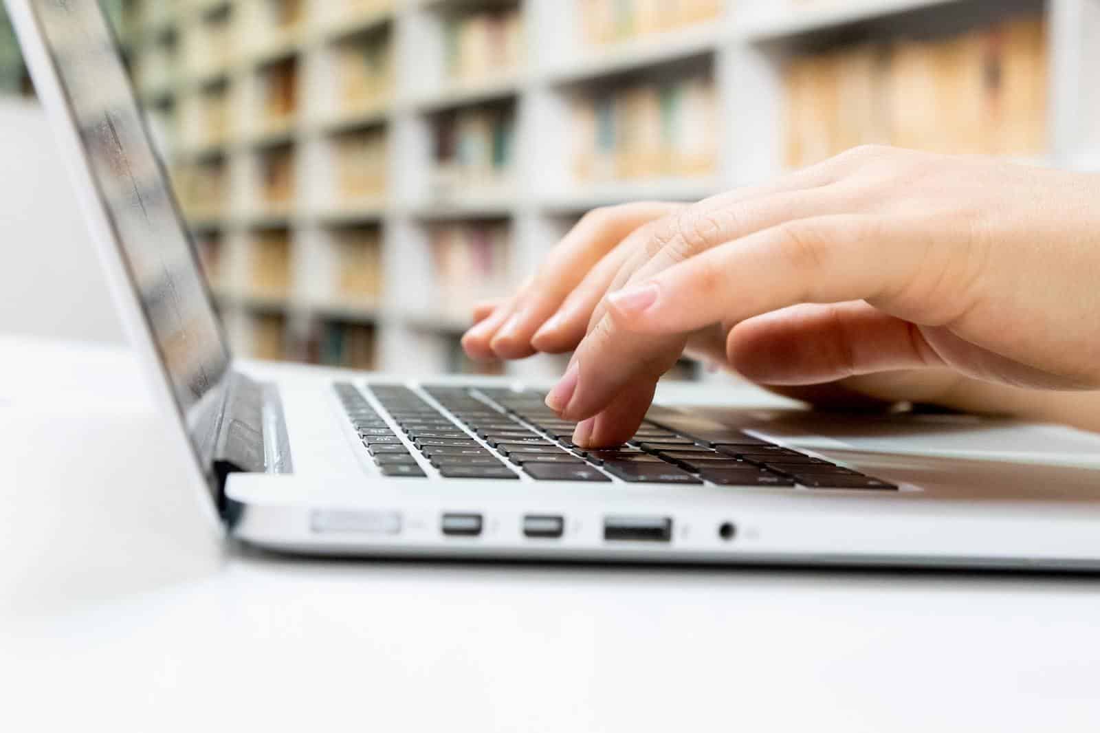 Woman typing on laptop