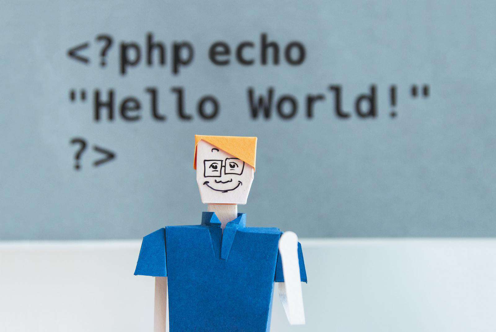 Cardboard figure in front of PHP code