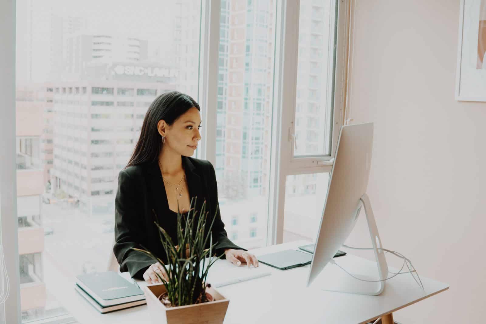 girl in black working on pc